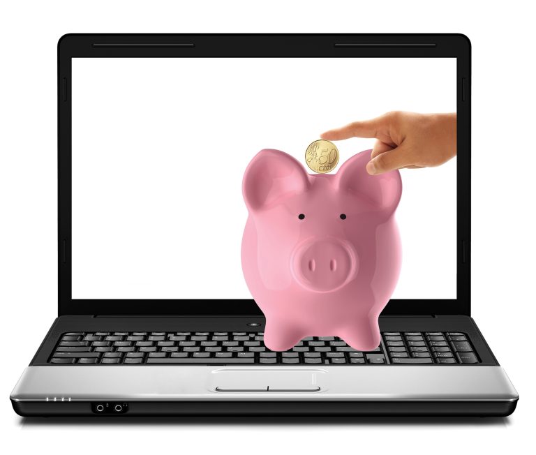 GO Get Organised digital advertising blog image - piggy bank with a coin being dropped into slot sat on top of a laptop