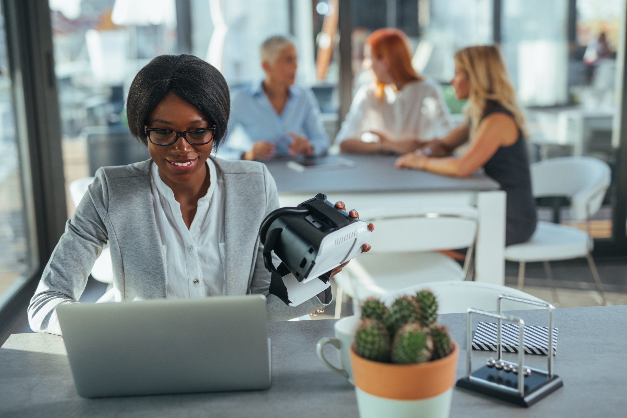 Benefits of using a Virtual Assistant (VA) blog with visual of a female at laptop holding a virtual mask