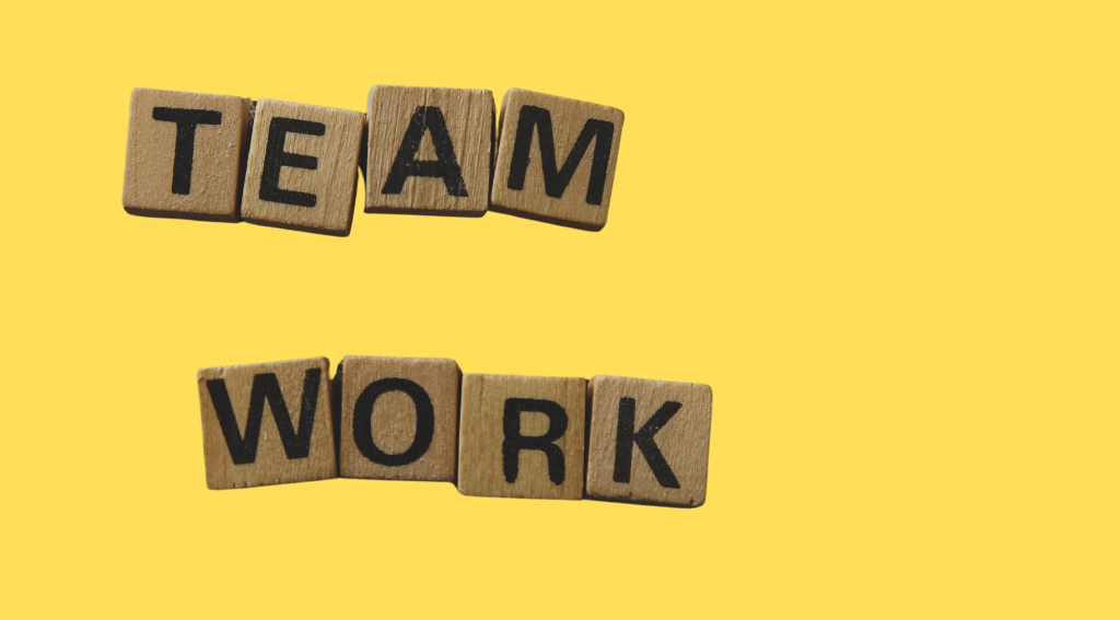Team Work - text written in blocks on yellow background