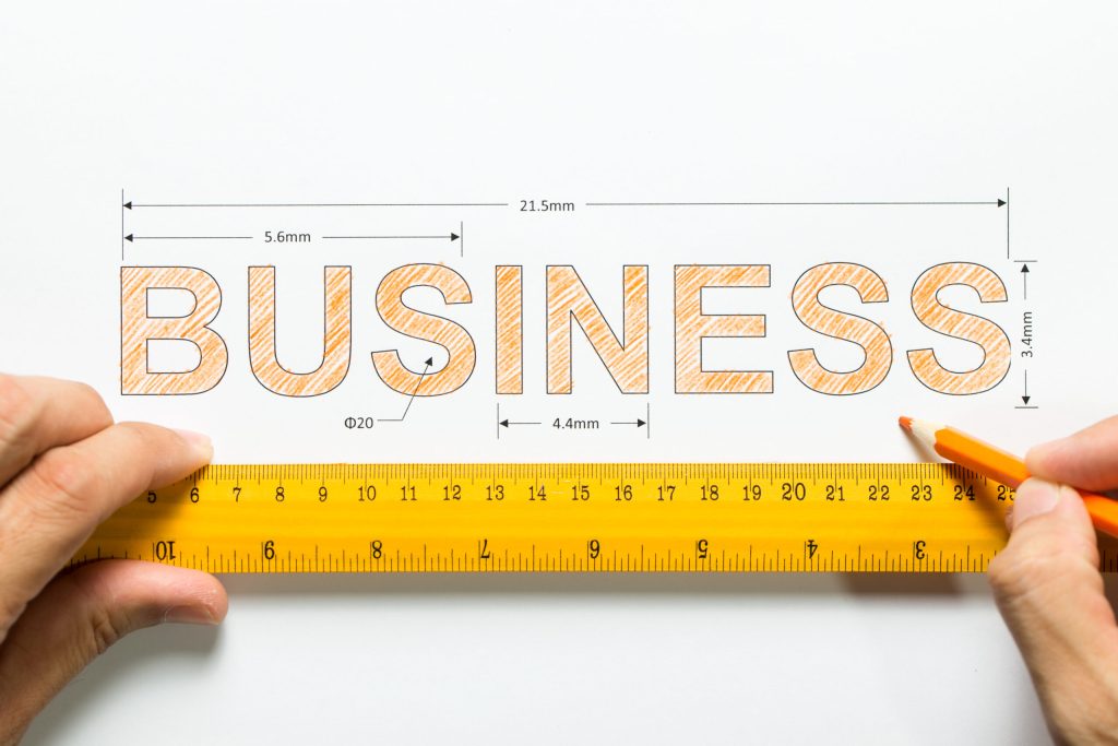 GO Get Organised blog on Scaling your business. Business text being measured by ruler