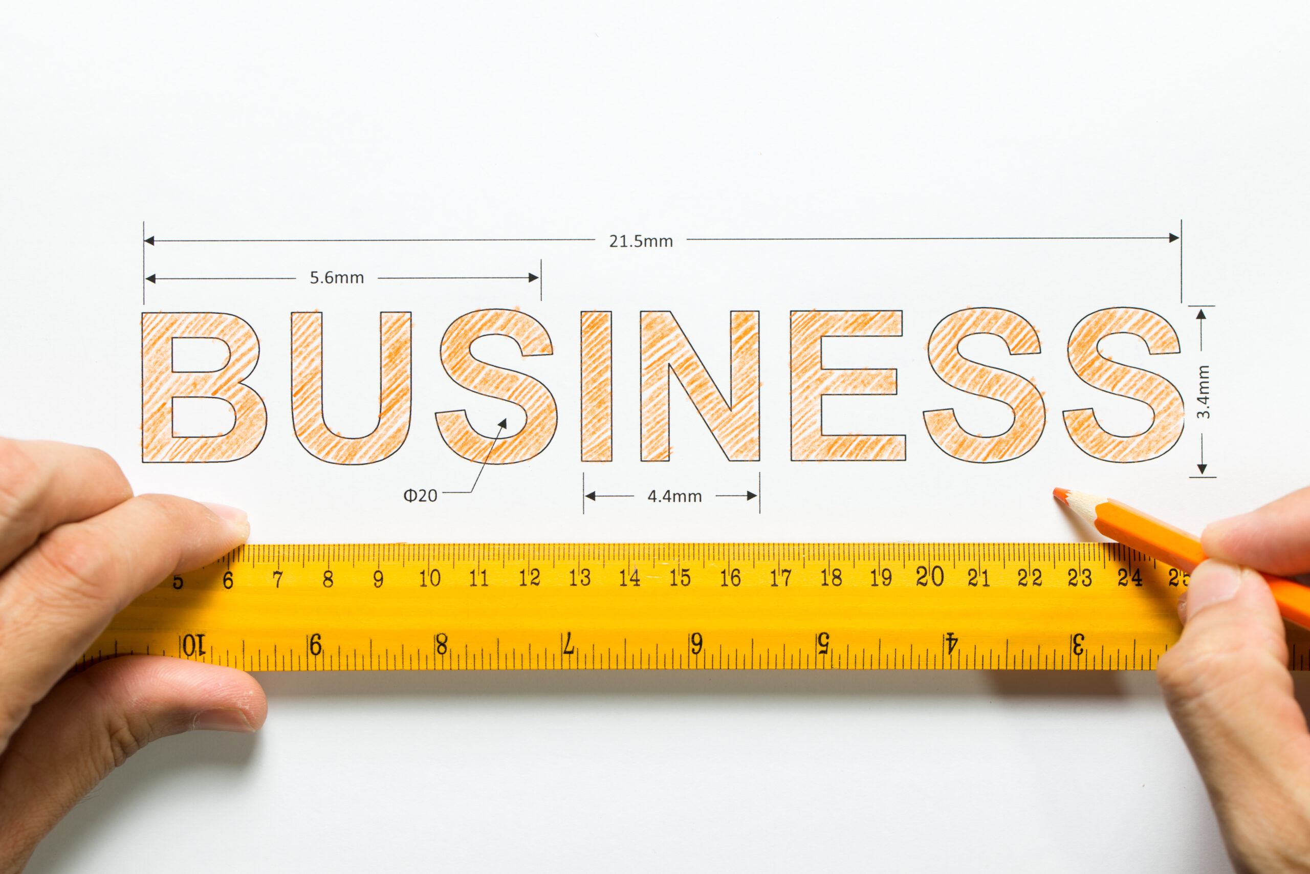 GO Get Organised blog on Scaling your business. Business text being measured by ruler